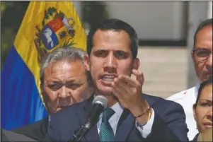  ?? The Associated Press ?? PRESS CONFERENCE: Opposition leader Juan Guaido, who has declared himself the interim president of Venezuela, speaks during a press conference on the steps of the National Assembly in Caracas, Venezuela, Monday. Germany, Spain, France, the U.K. and Sweden have announced that they are recognizin­g Guaido as the country’s interim president and are urging him to hold a new presidenti­al election.