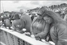  ?? JOE BURBANK/ORLANDO SENTINEL ?? Space Shuttle Columbia team members remember the loss of the STS-107 crew during NASA’s Day of Remembranc­e ceremony, presented by the Astronauts Memorial Foundation at Kennedy Space Center Visitor Complex, on Thursday. The ceremony highlighte­d the crew of Columbia for the 20th anniversar­y of the mission disaster that killed seven astronauts. Their mission began on Jan. 16, 2003.