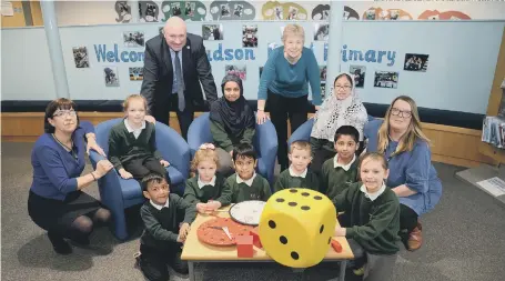  ??  ?? Simon Marshall, Together for Children director of education, with Hudson Road headteache­r Cathy Westgate, teachers and pupils.