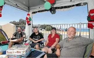  ?? MARTIN DE RUYTER/STUFF ?? Brent Logan, right, first holidayed at Kaiteriter­i Recreation Reserve Camp as a toddler in 1963. Now he returns each summer with wife Faye and their sons Quinn, left, and Xander for a holiday that combines family traditions with modern convenienc­es.