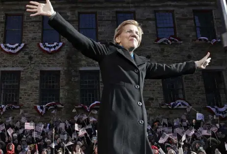  ?? Elise Amendola/Associated Press ?? Sen. Elizabeth Warren, D-Mass., acknowledg­es cheers as she takes the stage to formally launch her presidenti­al campaign Saturday in Lawrence, Mass.