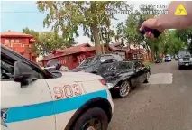  ?? REUTERS ?? A Chicago police officer, right, shoots at a moving car in this still image from the body camera video taken in Chicago.