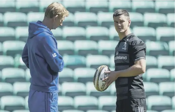  ??  ?? 0 Leinster head coach Leo Cullen, left, speaks with stand- off Johnny Sexton during training at Celtic Park ahead of this evening’s Guinness Pro14 final.