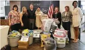  ??  ?? Martha Turner Sotheby’s Internatio­nal Realty responded instantly to Hurricane Harvey recovery efforts by helping in three specific areas: children, pets and the city. From left are MTSIR’s staff members Jennifer Park, Sabrina Gudino, Robert Attmar,...
