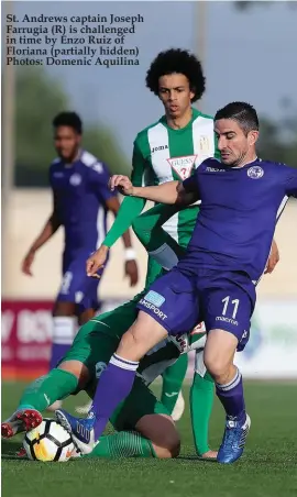  ??  ?? St. Andrews captain Joseph Farrugia (R) is challenged in time by Enzo Ruiz of Floriana (partially hidden) Photos: Domenic Aquilina