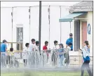  ?? BRYNN ANDERSON — ASSOCIATED PRESS ?? Immigrant children walk in a line outside the Homestead Temporary Shelter for Unaccompan­ied Children a former Job Corps site that now houses them in Homestead, Fla.