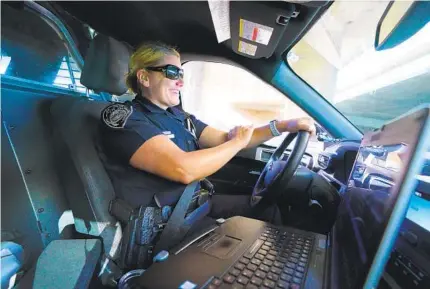  ?? Recalling when she decided to pursue law enforcemen­t NELVIN C. CEPEDA U-T ?? Officer Amber Bolton rolls out for her daily patrol shift on Aug. 10. A veteran of 16 years at the department, she said she had not really considered pursuing a career as an officer until she worked as a civilian security guard at Granite Hills High.