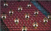  ?? JOHN LOCHER — THE ASSOCIATED PRESS ?? UNLV cheerleade­rs in the stands against Fresno State during the second half of a college basketball game on Feb. 24 in Las Vegas.