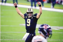  ?? BUTCH DILL/ASSOCIATED PRESS ?? New Orleans Saints quarterbac­k Drew Brees (9) reacts after a touchdown by Alvin Kamara in the second half of an NFL wild-card playoff victory against the Chicago Bears on Sunday.