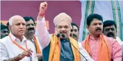  ?? PTI ?? BJP president Amit Shah wears a Mysore Peta, a traditiona­l headgear, upon his arrival in Bengaluru on Saturday on a three-day visit to Karnataka. Seen on the left is Karnataka ex-CM and BJP leader B.S. Yeddyurapp­a.