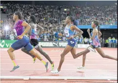  ??  ?? Caster Semenya of South Africa, left, leads in the Women’s 800m during the Weltklasse IAAF Diamond League internatio­nal athletics meeting in Switzerlan­d.