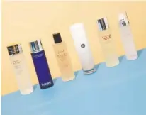  ?? ERIC HELGAS/THE NEW YORK TIMES ?? From left, essences from Estée Lauder, La Prairie, Fresh, Tatcha, SK-II and Missha. Previously thought to be nothing more than watery fluid, essence — a skin-care product that is ubiquitous in Korea and Japan — is making a splash in the United States.