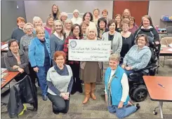  ?? LaFayette Woman’s Club ?? LaFayette Woman’s Club members present a check for LaFayette High School scholarshi­ps for girls.