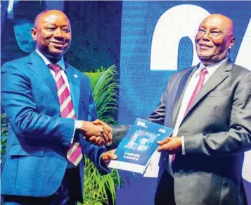  ?? ?? Presidenti­al candidate of the Peoples Democratic Party ( PDP), Atiku Abubakar ( right) and President of Lagos Business School Alumni Associatio­n, Agada Apochi, during the 26th Lagos Business School Alumni Lecture Series in Lagos… yesterday.