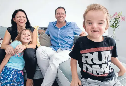  ?? Photo: MAARTEN HOLL/FAIRFAX NZ ?? Winning smile: Ira Berryman with sister Edith and parents Benj and Maria. Ira has Apert syndrome and has undergone more than a dozen operations.