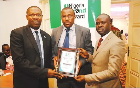  ??  ?? General Manager, Corporate Communicat­ion, Skyway Aviation Handling Company Limited, Basil Agboarumi (left); General Manager, SIFAX Off-dock Terminal, Trinity, Oliver Omajuwa; Corporate Affairs Manager, SIFAX Group, Olumuyiwa Akande, receiving the ‘Most...