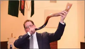  ?? (Special to the Democrat-Gazette/Dixie Knight) ?? Rabbi Kalman Winnick blows the shofar during the 2014 Love Thy Neighbor interfaith prayer gathering in Little Rock. This year’s gathering will be held online on Thursday at the Interfaith Center’s YouTube channel.