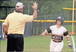  ?? Jeremy Stewart ?? Rockmart’s Gracey Arnold (right) celebrates with coach Steve Luke as she rounds third after hitting a solo home run in Game 1 of last Thursday’s region playoff doublehead­er against Adairsvill­e.