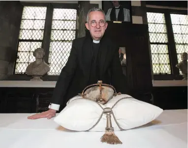  ??  ?? The very Rev Dermot Dunne with the heart of St Laurence O’Toole, Dublin’s patron saint at Christ Church Cathedral, Dublin.The relic was stolen from the cathedral in March 2012. Photo: Gareth Chaney