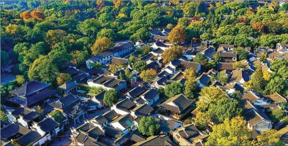  ?? PHOTOS PROVIDED TO CHINA DAILY ?? Above and bottom: Huishan Ancient Town in Wuxi, Jiangsu province, has 118 ancestral temples that allow visitors to come free. Niushou Mountain, or Ox Head Mountain, which lies in the Jiangning district of Nanjing, Jiangsu, has palaces and lovely landscapin­g built on a decaying old mine.