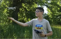  ?? NATACHA PISARENKO — THE ASSOCIATED PRESS ?? Andriy Pokrasa, 15, lands his drone on his hand during an interview with The Associated Press in Kyiv, Ukraine, Saturday.