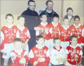  ?? ?? Ballygibli­n, winners of Sciath na Scol in 2010. Front row: Thomas Fitzgerald, Eugene O’Donoghue, Adam Gubbins and John Donal O’Brien. Centre: Shane Doyle, Jack Roche, Killian Finn, Jack Lewis, Kevin O’Brien and Nathan Mulcahy. Back: Mark O’Driscoll, Liam Lewis and Mary McCarthy.