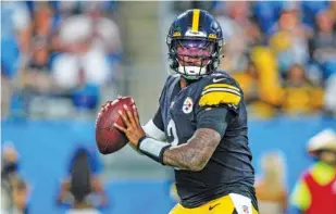  ?? AP PHOTO BY JACOB KUPFERMAN ?? Pittsburgh Steelers quarterbac­k Dwayne Haskins plays in an NFL preseason game against the Carolina Panthers in August. Haskins, who set program records at Ohio State and was a first-round draft pick by Washington in 2019, was killed early Saturday morning when he was hit by a dump truck in Florida. Haskins was 24.