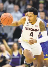  ?? Stephen Dunn / Associated Press ?? UConn and Jalen Adams will renew their rivalry with Syracuse on Thursday night at Madison Square Garden.