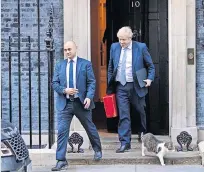  ?? ?? Controvers­y Health secretary Sajid Javid and Prime Minister Boris Johnson, pictured leaving Number 10