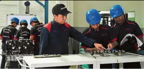  ??  ?? raising skills: The first five apprentice­s have started their course at the Isuzu Technical School.