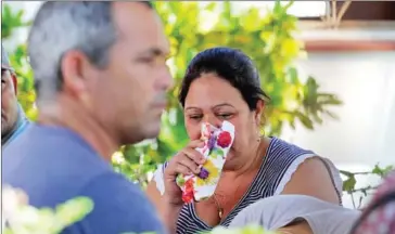  ?? YAMIL LAGE/AFP ?? A relative of a victim of the plane that crashed shortly after taking off from Jose Marti airport killing 107 people cries at the Institute of Legal Medicine in Havana, on Saturday.