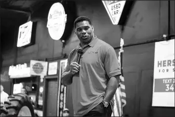  ?? NICOLE CRAINE / THE NEW YORK TIMES ?? Herschel Walker, a Republican candidate for Senate, campaigns last month in Ocilla, Ga. Walker, who is challengin­g Sen. Raphael Warnock, D-GA., has put forward dubious theories on climate change.