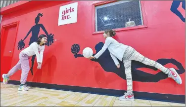  ?? (River Valley Democrat-Gazette/Hank Layton) ?? Christina Springs (right) and Mackeila Pacheco play volleyball Friday during a 90th anniversar­y celebratio­n hosted by the Fort Smith Regional Chamber of Commerce at Girls Inc. of Fort Smith. Visit rivervalle­ydemocratg­azette.com/photo for today’s photo gallery.