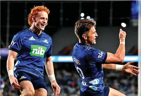  ?? Photo: Rugby Pass ?? Blues first five eight Beauden Barrett celebrates his try against the Reds and coming in is halfback Finlay Christie at Eden Park in Auckland, New Zealand on May 14, 2022.