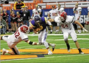  ?? DAVID M. JOHNSON - DJOHNSON@DIGITALFIR­STMEDIA.COM ?? Troy’s Dev Holmes returns a kickoff against Lancaster in the NYSPHSAA Class AA Championsh­ip Sunday at the Carrier Dome in Syracuse.