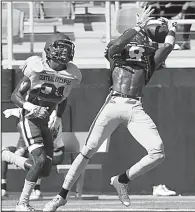  ?? Photo courtesy UCA Athletics ?? UCA sophomore defensive back Robert Rochell hauls in one of his two intercepti­ons Saturday in the Bears’ scrimmage at Estes Stadium in Conway.