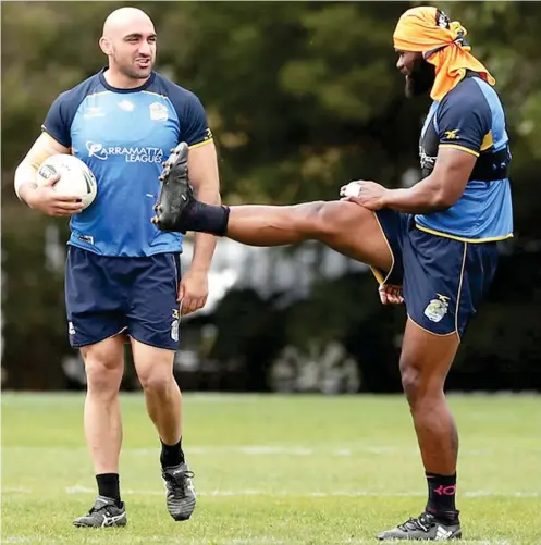  ?? Photo: Zimbio ?? Tim Mannah (left) talks to Semi Radradra (right) during the Parramatta Eels NRL training session at Old Saleyards Reserve in Sydney, Australia on September 12, 2017.