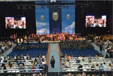  ?? RON SEYMOUR/The Daily Courier ?? Graduates receive their degrees Thursday during convocatio­n ceremonies at UBC Okanagan.