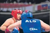  ?? AP ?? India’s Pooja Rani (left) fights Algeria’s Ichrak Chaib.