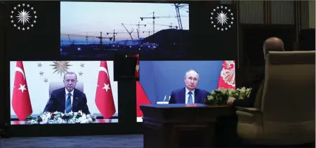  ??  ?? Russian President Vladimir Putin and Turkish President Recep Tayyip Erdoğan virtually attended the foundation-laying ceremony for the third reactor of the plant