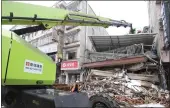  ?? SHEN HONG — XINHUA VIA AP ?? Rescue workers manuever crane over the collapsed site of a self-constructe­d residentia­l building in Changsha, central China's Hunan Province, on Saturday.