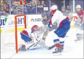  ?? Chase Stevens Las Vegas Review-journal @csstevensp­hoto ?? Golden Knights center Patrick Brown fights to score against Avalanche goaltender Philipp Grubauer in the third period Sunday.