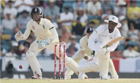  ??  ?? West Indies’ Shimron Hetmyer plays a shot as England’s Ben Foakes looks on.