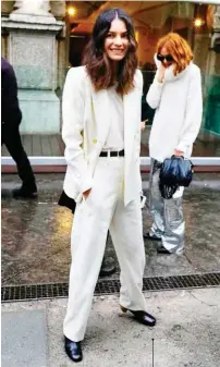  ??  ?? “Stylebop fashion director Leila Yavari looks super-polished in a white tailored suit and top, yet still comfortabl­e in the exaggerate­d silhouette­s. #win.”