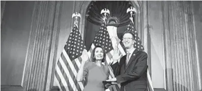  ?? SUSAN WALSH/AP ?? House Speaker Nancy Pelosi, D-Calif., poses during a ceremonial swearing-in with Rep. Derek Kilmer, D-Wash., in January.