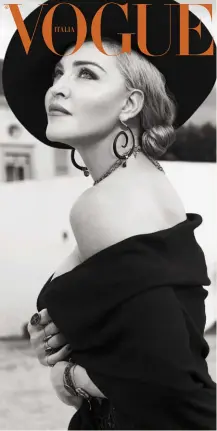  ??  ?? MADONNA IN SAINT LAURENT BY ANTHONY VACCARELLO PHOTOGRAPH­ED BY MERT &amp; MARCUSSTYL­ED BY EYOB YOHANNES.Foulard di lana con frange di suede indossato come abito e cappello di feltro con nastro in pelle SAINT LAURENT BY ANTHONY VACCARELLO; orecchini VANESSA MONTIEL; rosario QUE SERA; anelli e bracciali PASCALE MONVOISIN. Sulla pelle, The Reinventio­n Cream di MDNA SKIN. hair Andy Lecompte @ The Wall Group. make-up Aaron Smith Henrikson. manicure Adam Slee @ Streeters. on set Across Media Production.