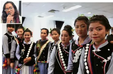  ??  ?? This is our culture: Refugees from the ethnic Myanmar Chin community in traditiona­l costumes at the conference. Inset: Glorene A. Das.