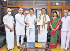 ?? PTI ?? DMK president MK Stalin and Tamil Nadu Congress Committee President K.S. Alagiri pose with the agreement paper on seat-sharing for upcoming state polls in Chennai on Sunday.
