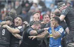  ?? ?? Glasgow Warriors, above, celebrate after scoring a lastminute try against Exeter which was later disallowed following a TMO review, leaving the visitors dejected, right, as they fell to a 19-17 defeat