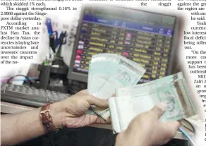  ??  ?? The ringgit is tracking the general weakness in Asian currencies on investors’ risk aversion, economists say. – AFPPIX